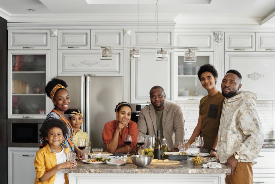 family posing for a photo in the kitchen