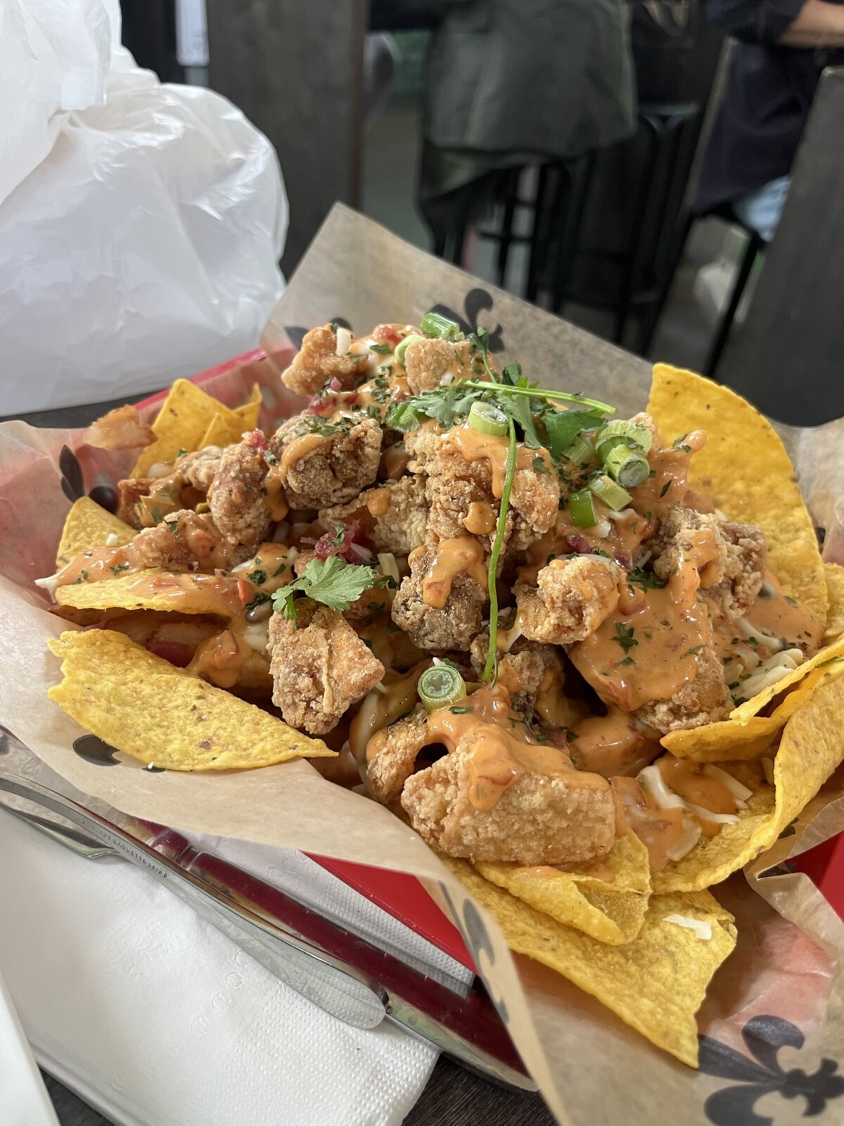 Chicken cracklin nacho fries at Family Cajun Kitchen New Orleans St. Roch Market Tostitos Super Bowl